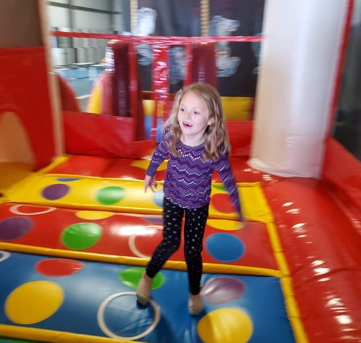 Kids having fun bouncing in a bounce house